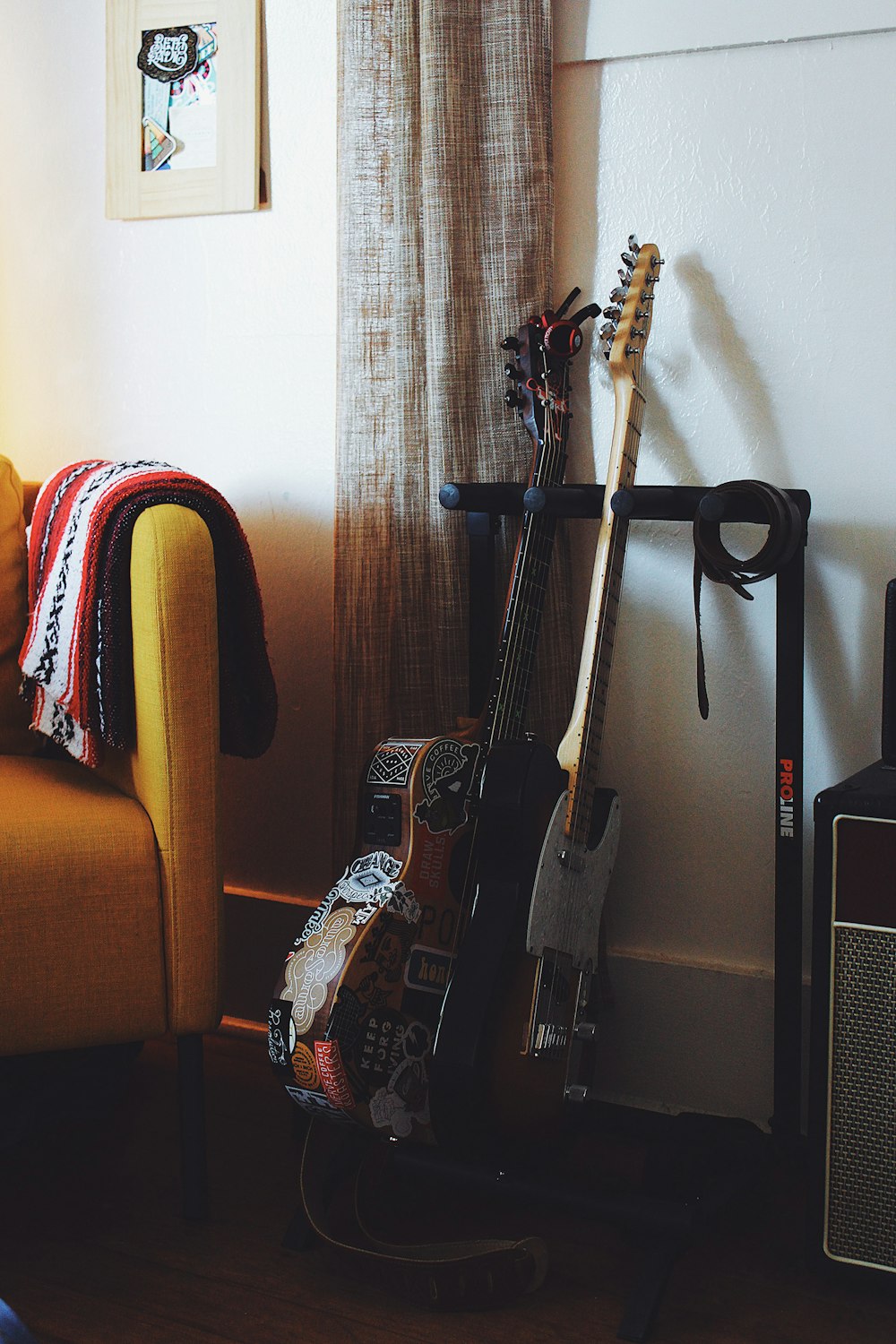 brown and black acoustic guitars