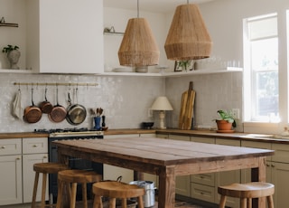 stainless steel cooking pots on white table