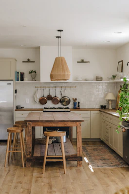 rustic kitchen with wooden island and stools