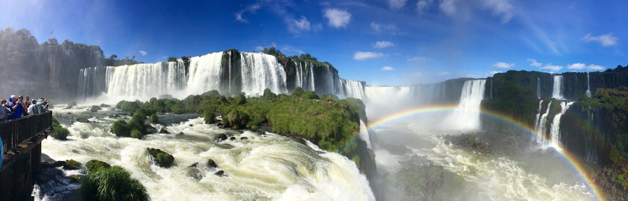 waterfalls under blue sky during daytime