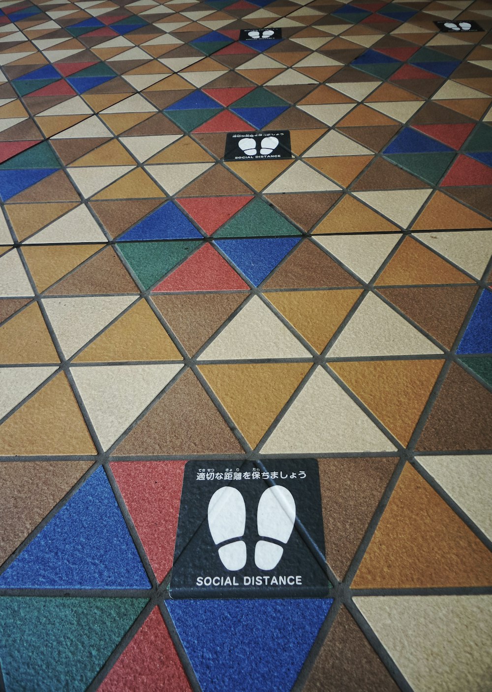 brown blue and red square floor tiles