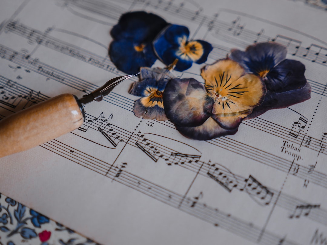 blue and white flower on musical notes