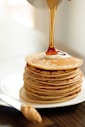 brown pancakes on white ceramic plate