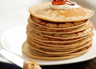 brown pancakes on white ceramic plate