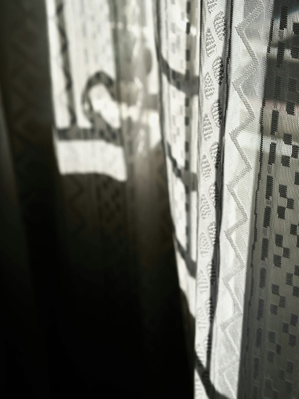 white and black window curtain