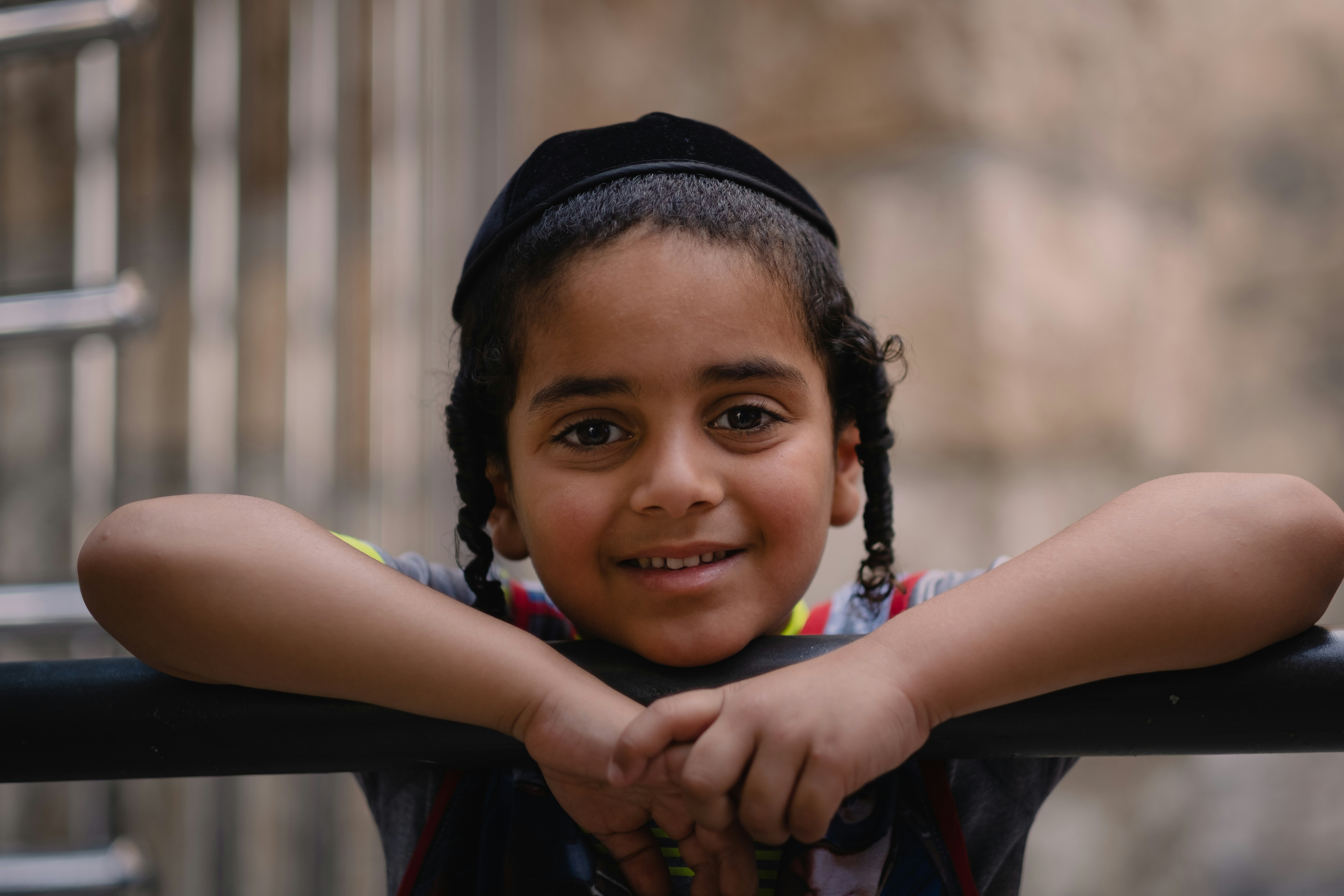 girl in black knit cap smiling