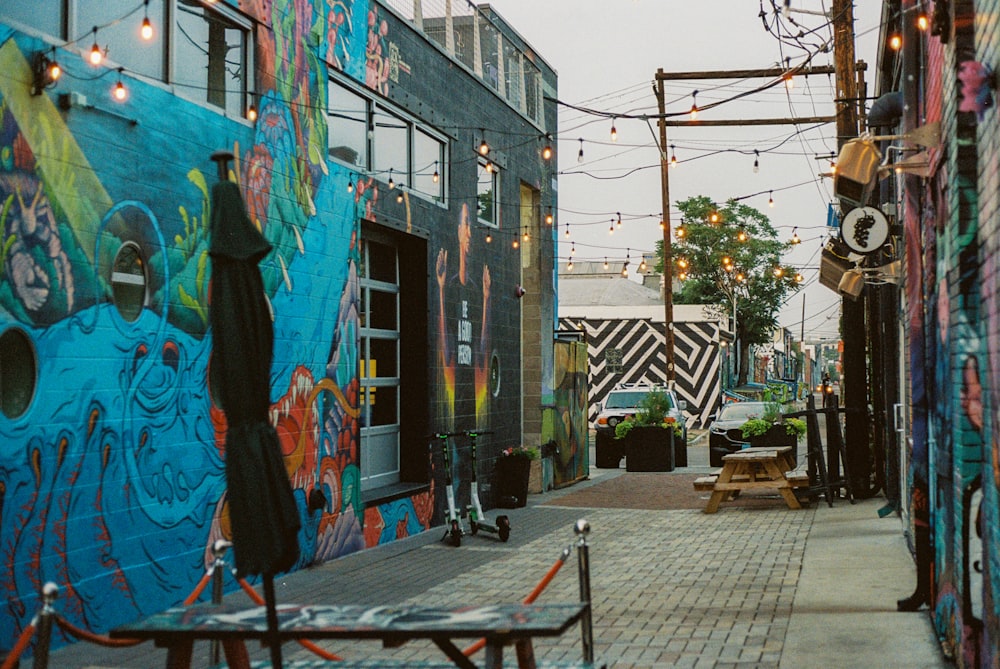 blue and black graffiti on wall during daytime