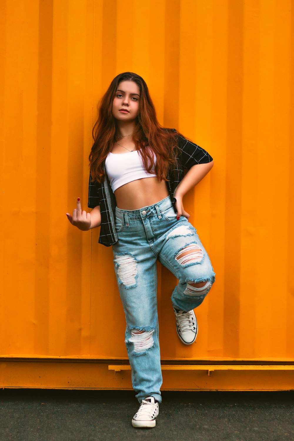 woman in blue denim jeans and white crop top