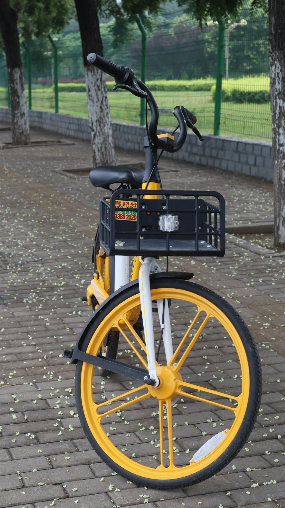 black and yellow bicycle on brown brick floor