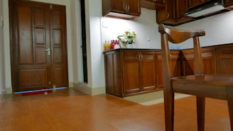A warm kitchen scene with Marta Soares preparing a meal, smiling and welcoming.