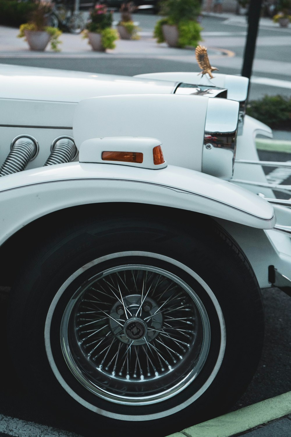 white car with chrome wheel