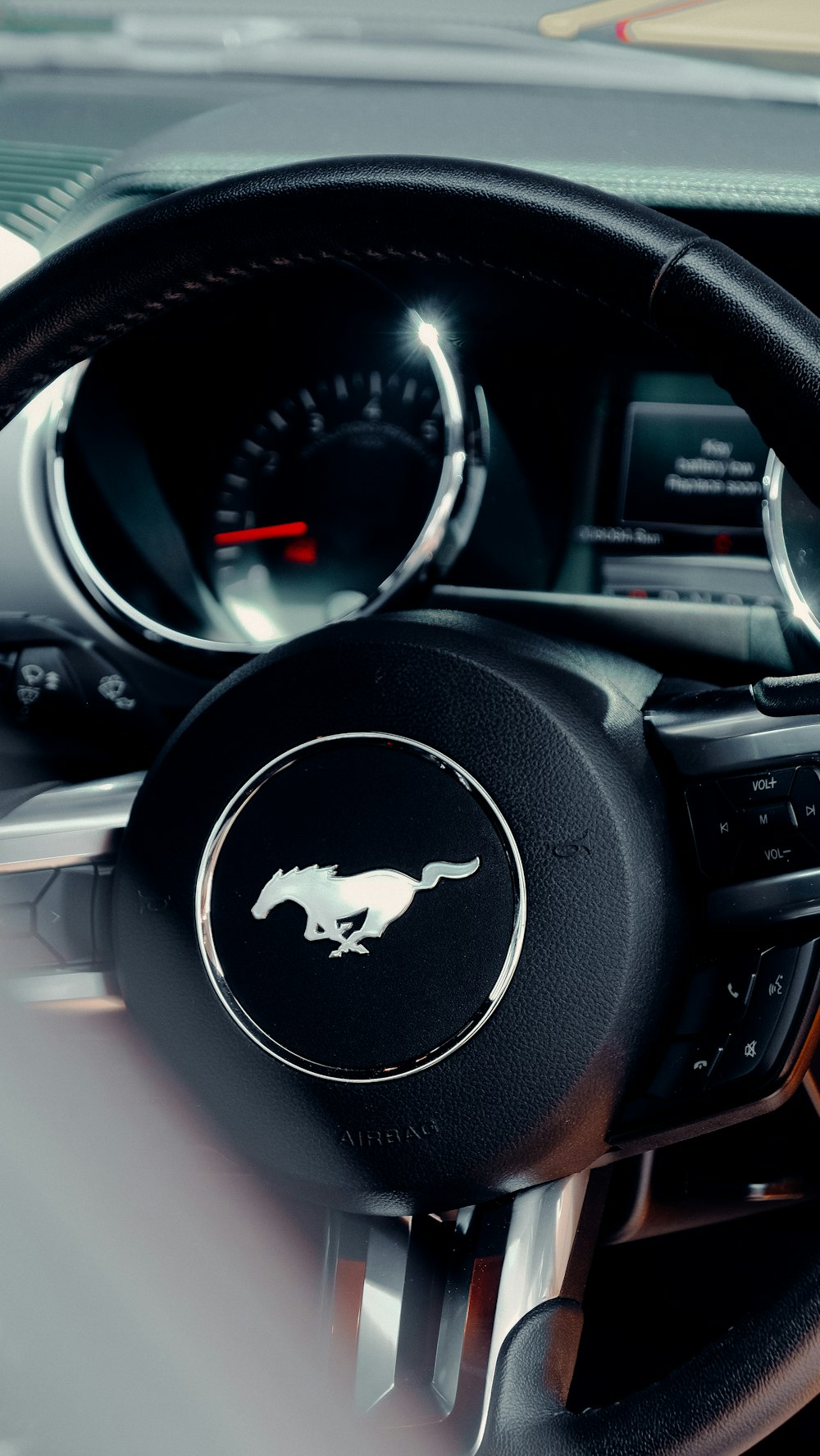 black and white ford steering wheel