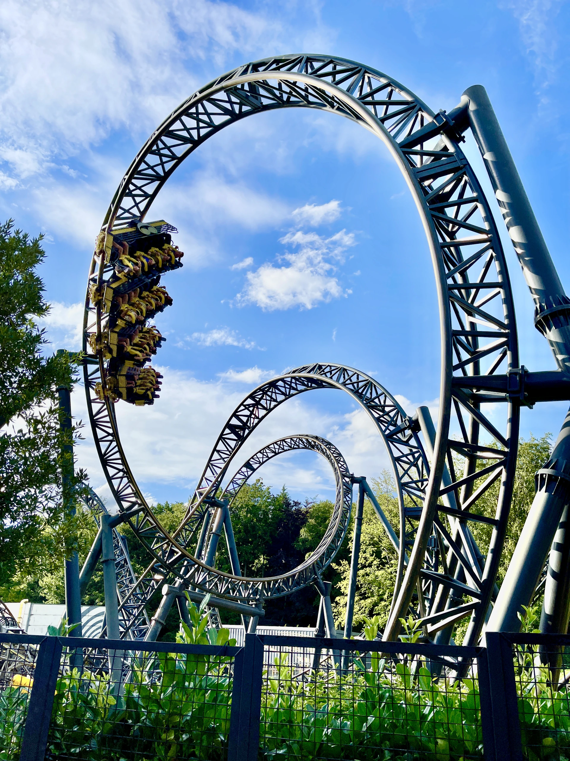 green and brown roller coaster under blue sky during daytime