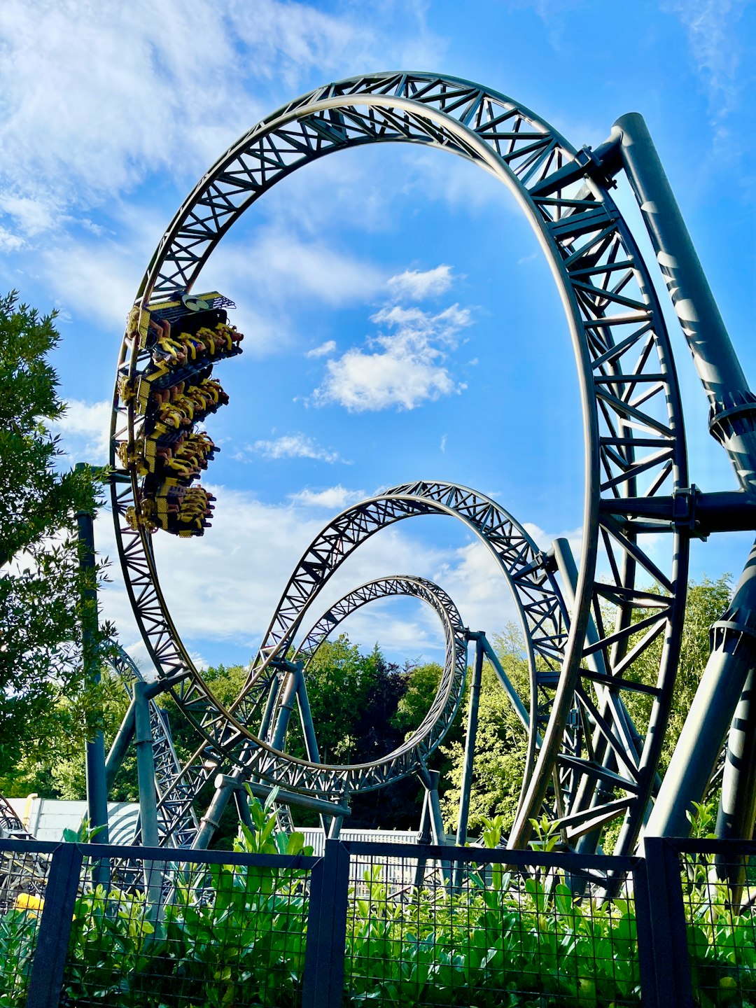 green and brown roller coaster under blue sky during daytime