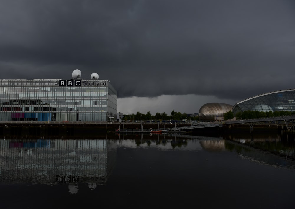 white concrete building near body of water during daytime