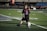 A happy child playing football at akadoq's training session.