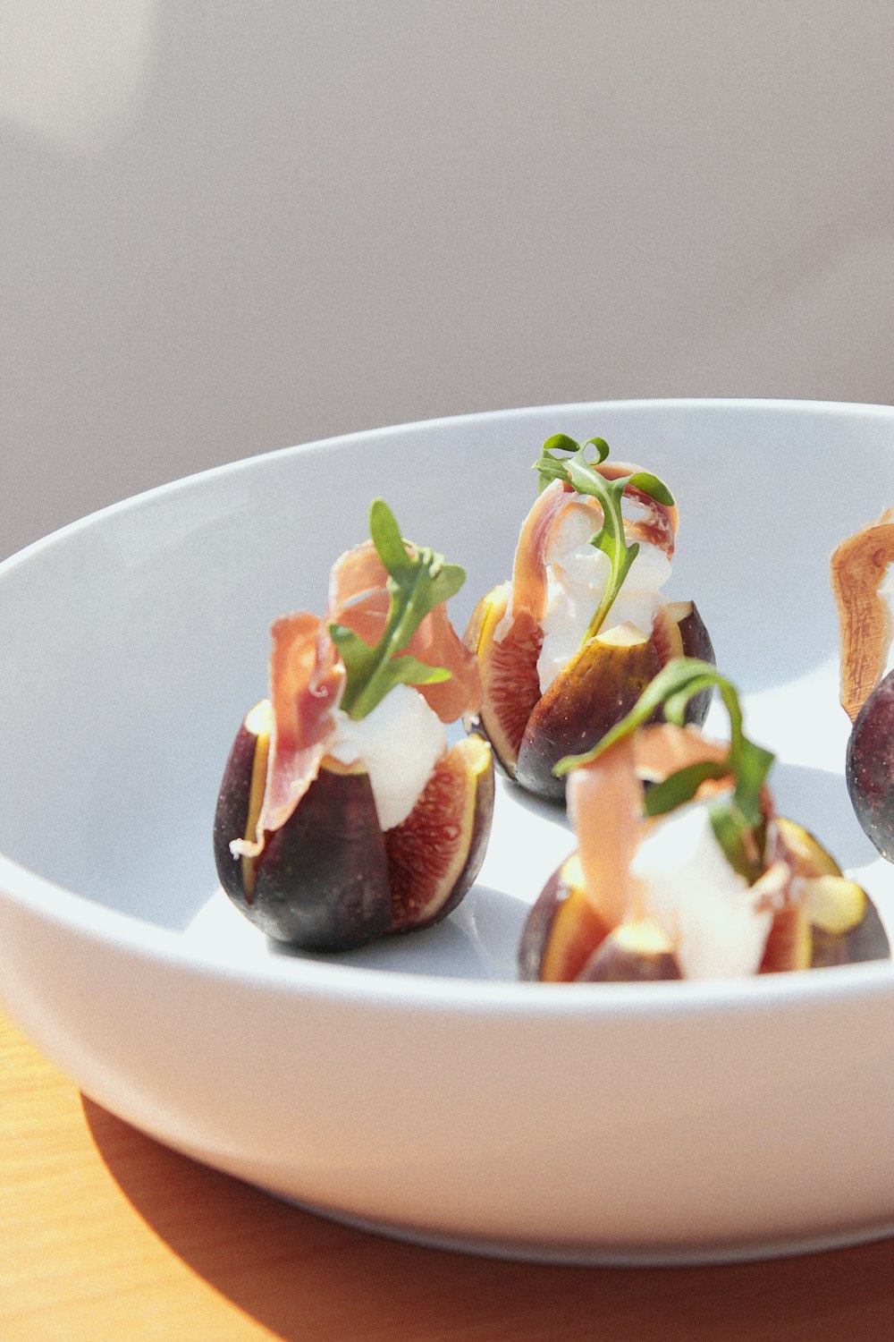 sliced fruits on white ceramic bowl