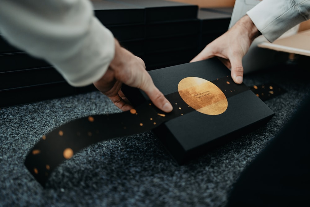 person holding brown wooden chopping board