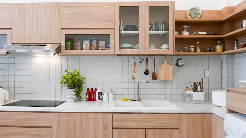 white ceramic sink with brown wooden cabinet