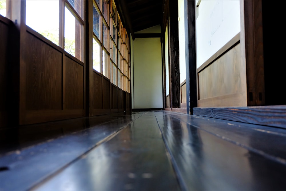 brown wooden door on gray concrete floor