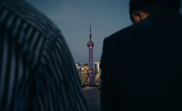 man in black jacket standing near woman in black jacket