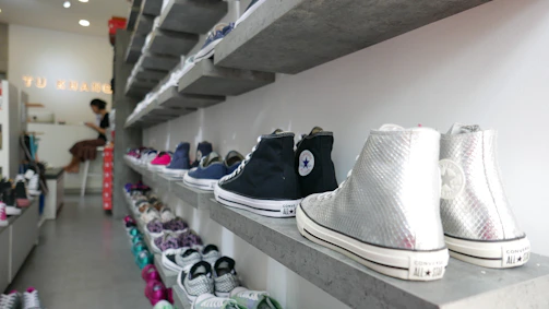 A friendly customer service representative ready to assist with shoe orders.