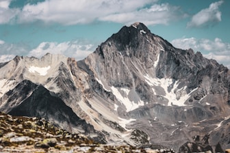 snow covered mountain under blue sky during daytime