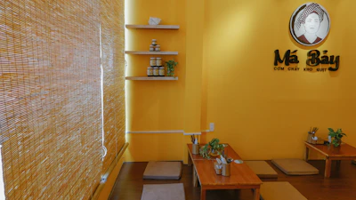 Cozy interior of Golden Ginger restaurant with warm lighting and elegant Asian decor.
