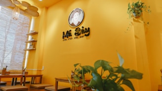 A warm, inviting dining area decorated with traditional Bengali art and vibrant colors.