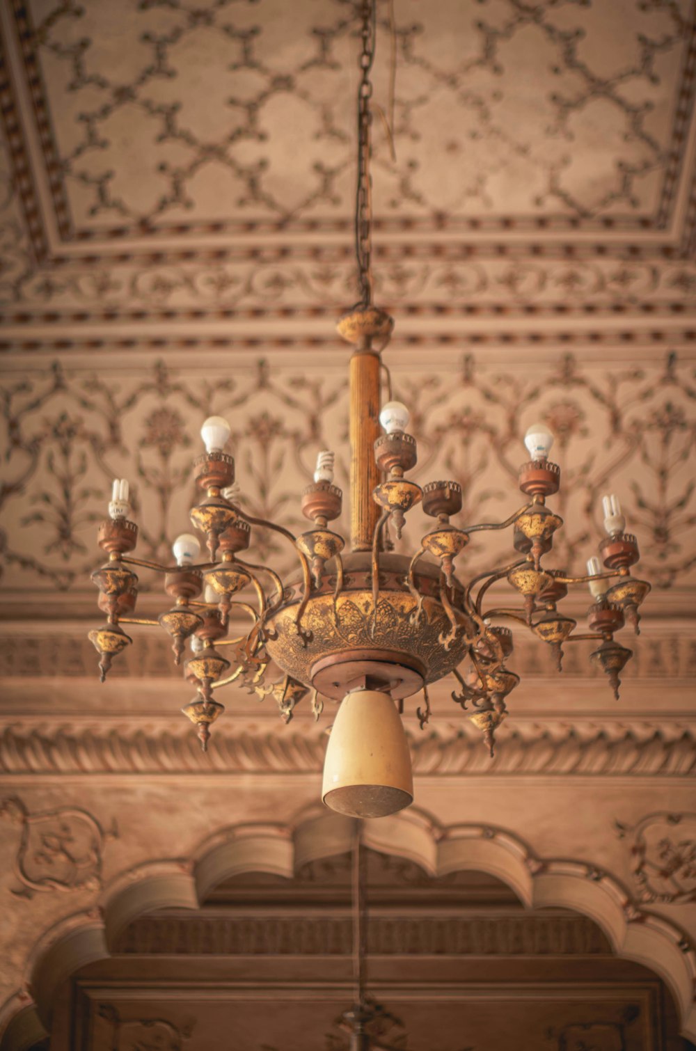 brass and white uplight chandelier