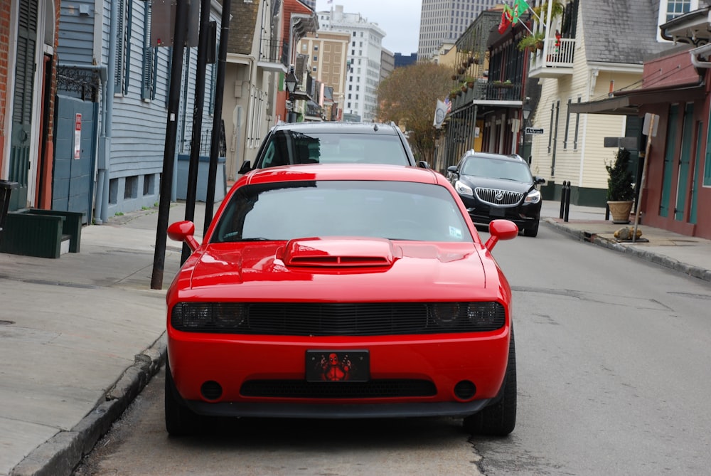 red ferrari car on road during daytime