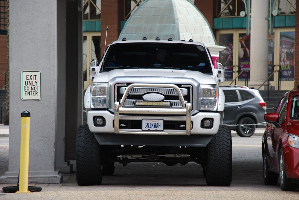 white chevrolet car on road during daytime