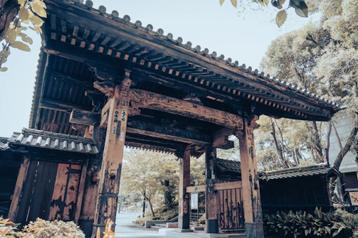 A beautifully crafted gate with intricate woodwork, inviting and secure.