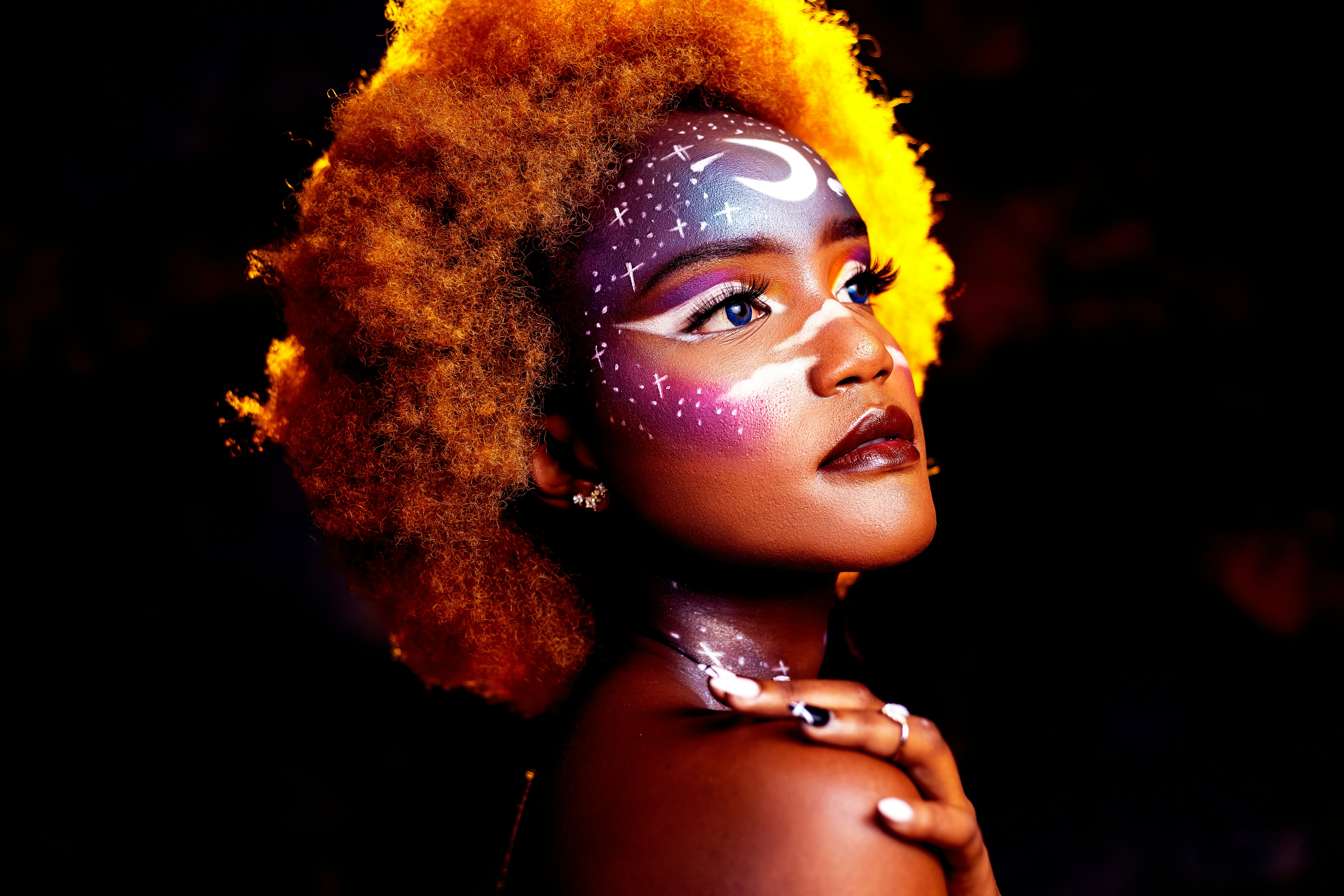 woman with yellow hair wearing silver necklace