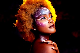 woman with yellow hair wearing silver necklace