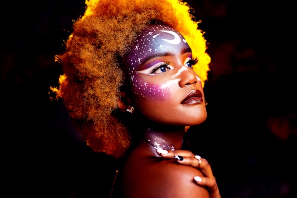 woman with yellow hair wearing silver necklace