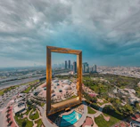 brown wooden framed mirror on top of a building