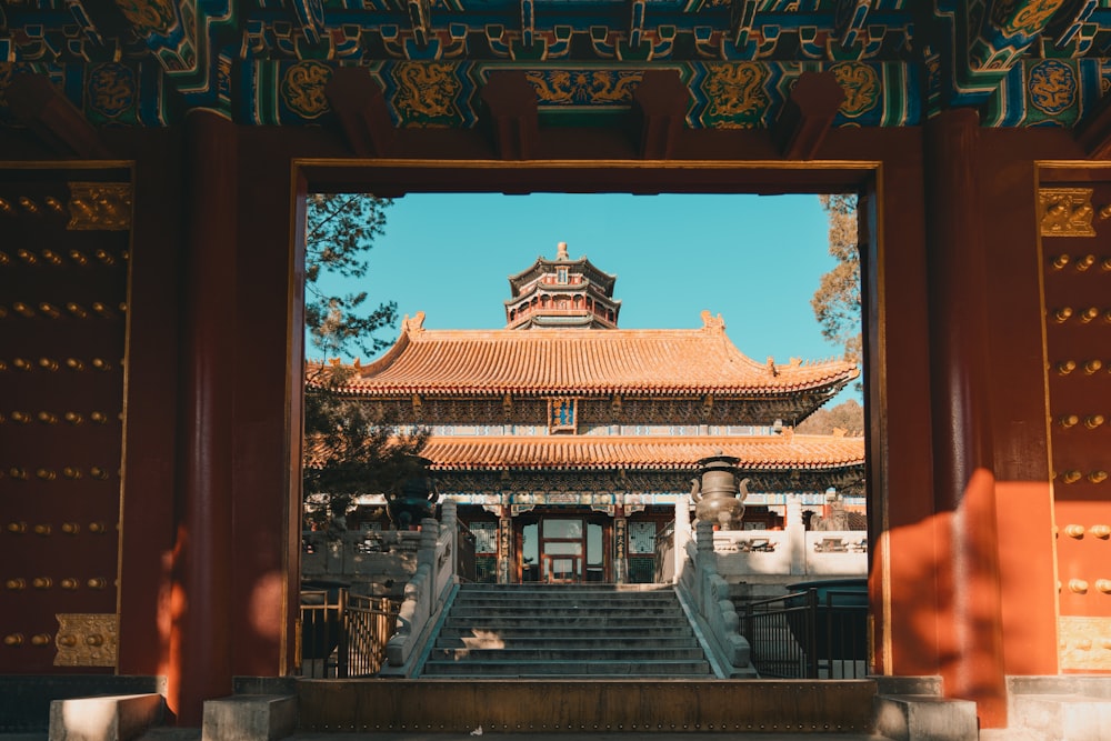 brown wooden framed red and white temple