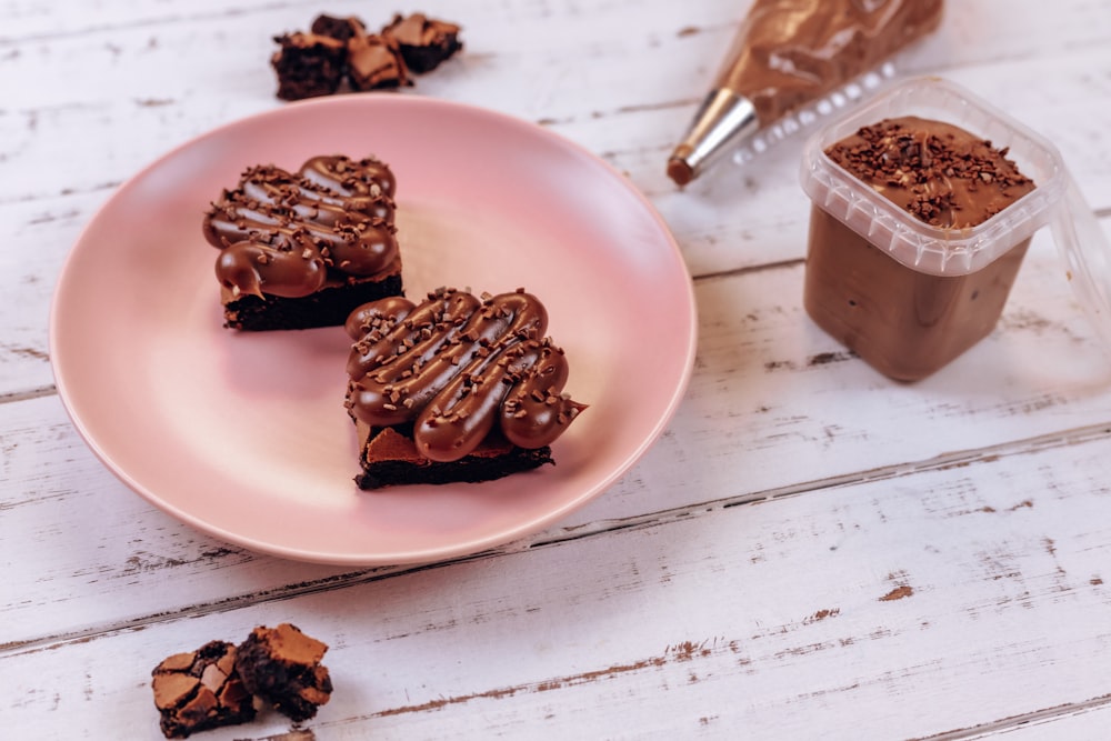 chocolate bars on pink ceramic plate