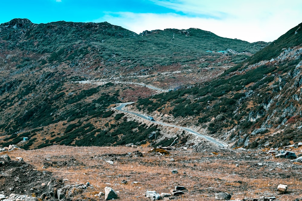 brown and green mountains under blue sky during daytime