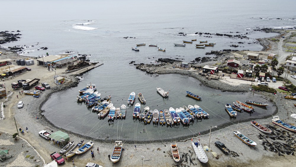 white and blue boats on sea during daytime