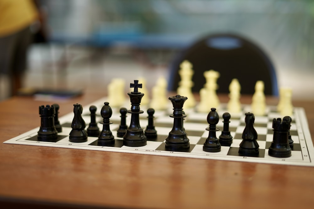 black chess pieces on chess board