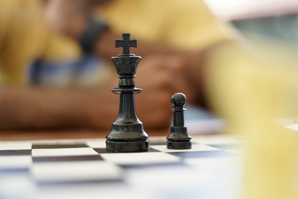 black chess piece on chess board