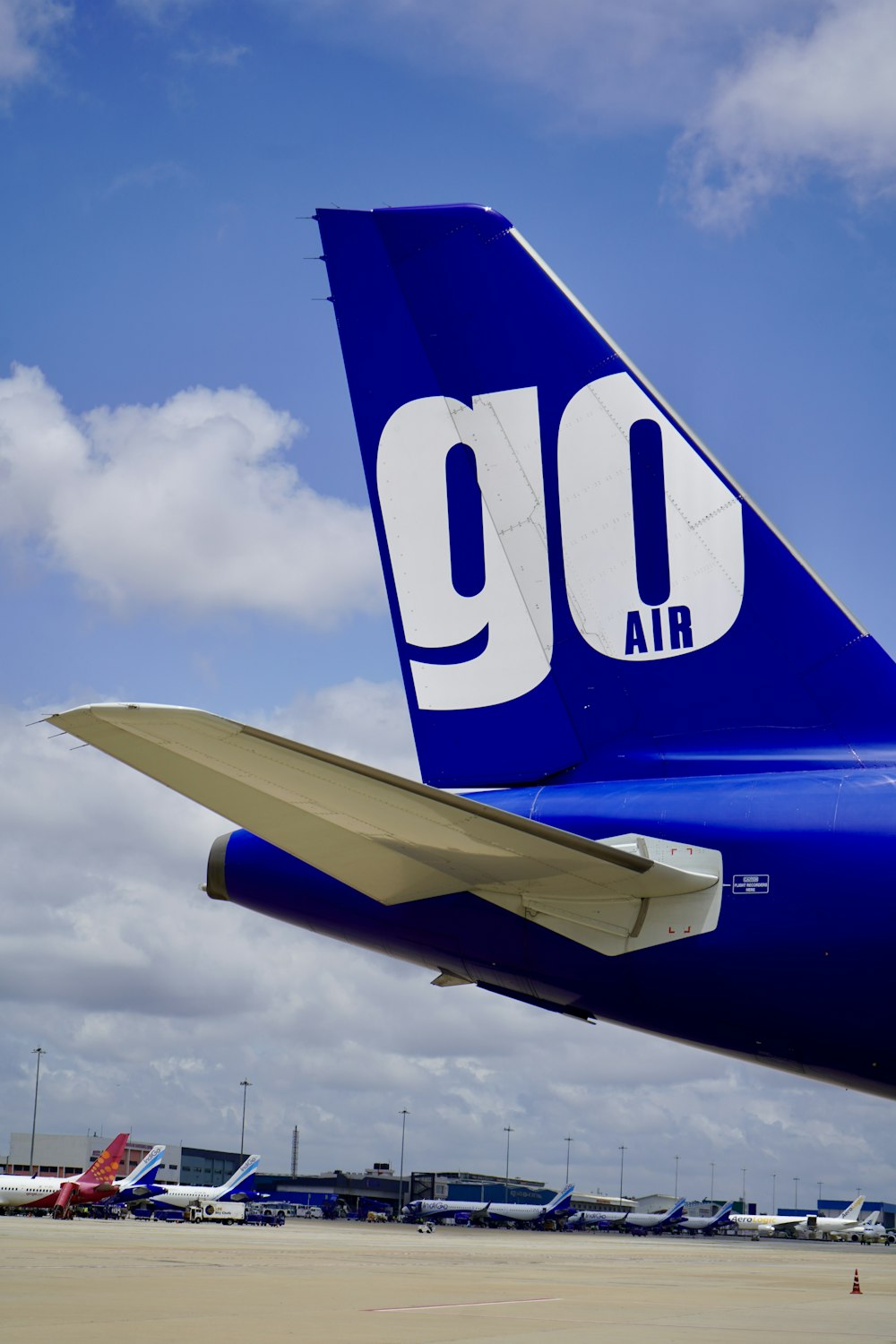 blue and white airplane under blue sky during daytime