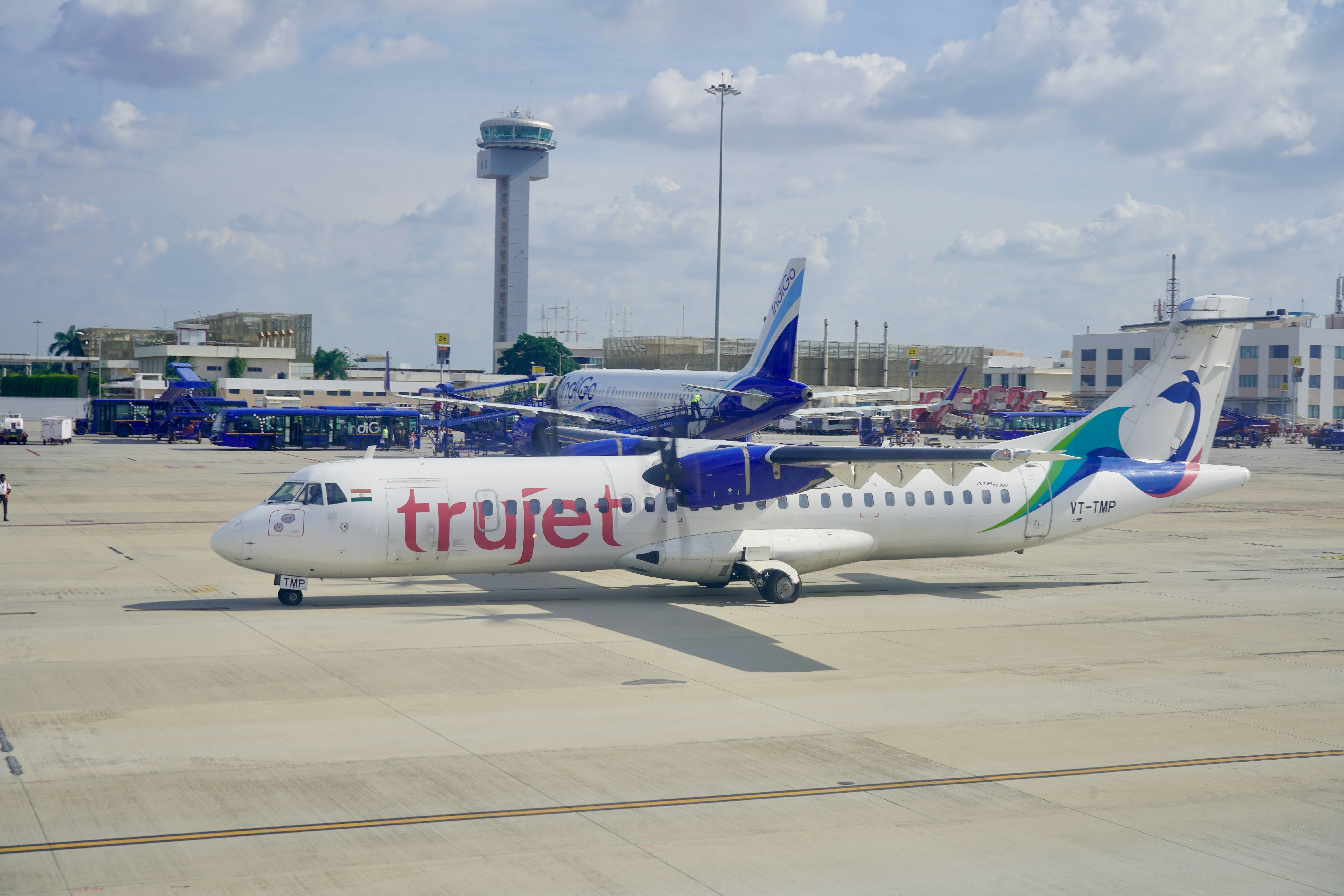 white and blue passenger plane on airport during daytime, A small ATR 72 of Trujet Airlines