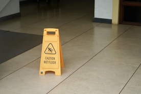 yellow caution wet floor sign