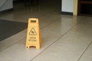 yellow caution wet floor sign