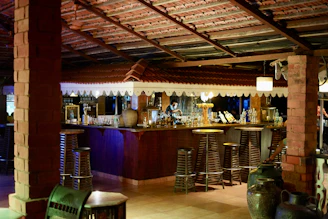 brown wooden bar stools and table