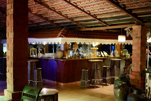 brown wooden bar stools and table