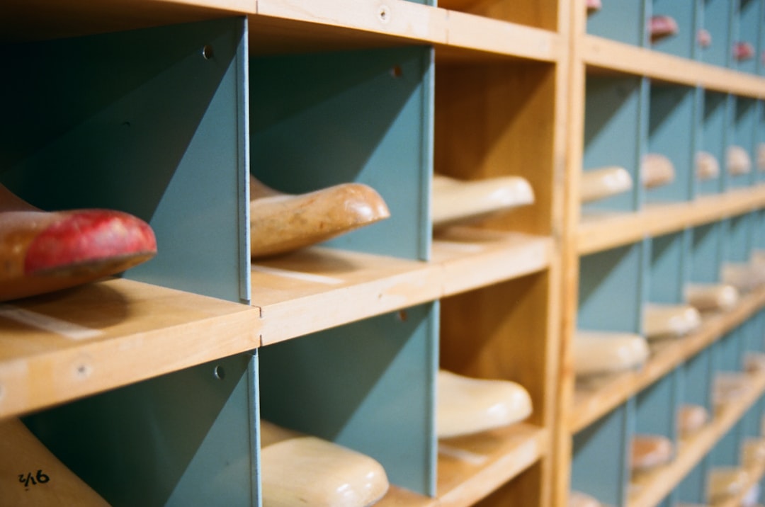 person holding white wooden shelf